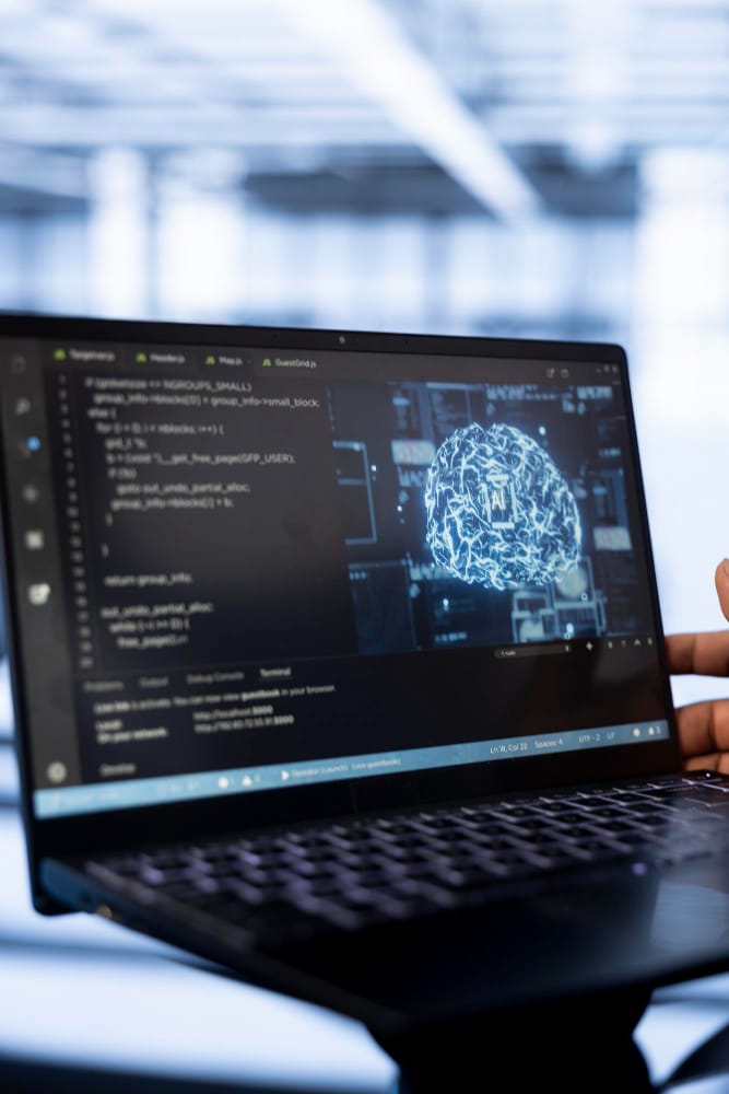 Laptop screen displaying AI code and digital brain, representing Claude Pro pricing and AI development tools.